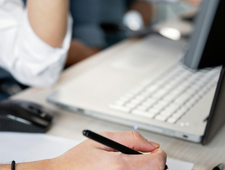 Editor reviewing a manuscript to illustrate the difference between copyediting and proofreading