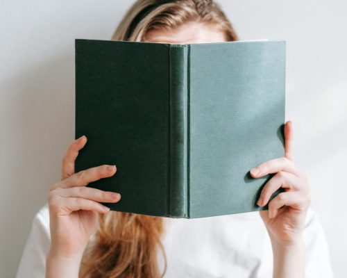 Author reviewing opening chapter notes to improve reader engagement from page one