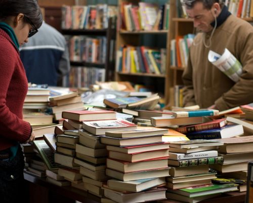 Resources - Open manuscript on writing desk — hire an editor before querying to give your submission its best chance